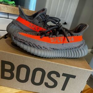 Yeezy Gray and Orange Sneakers with Knit Pattern